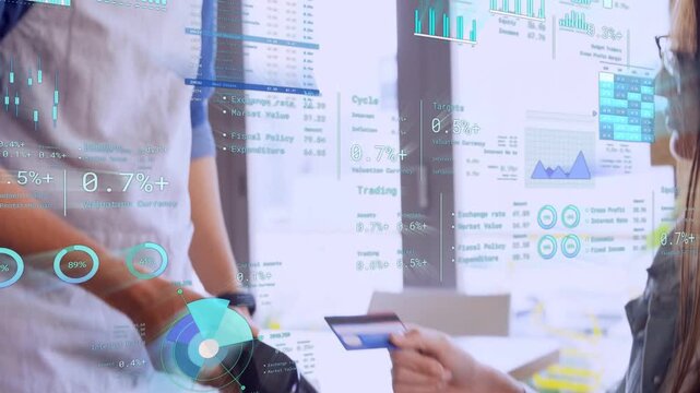 Server reaching terminal as customer handing card, tapping to pay while finance charts float