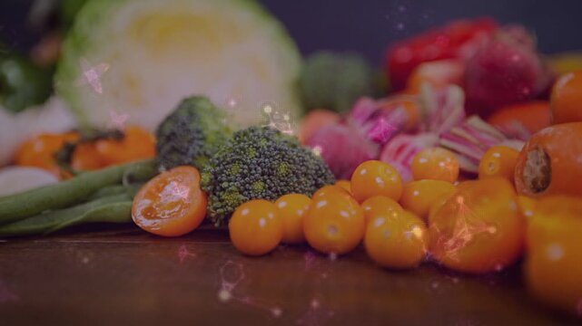 Vegetables on wooden table, bokeh lights drifting, accenting halved tomato and broccoli for food