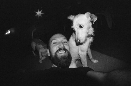 Happy man takes selfies with his pets