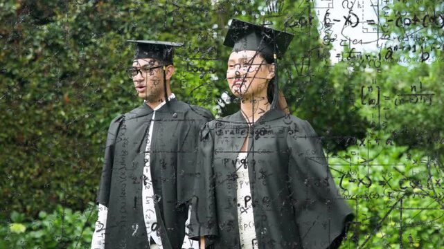 2 graduates standing in park, math overlay drawing gazes, smiling while adjusting cap for education