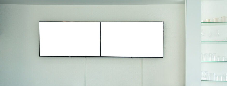 Two blank white horizontal digital screens mounted on a minimalist wall. High-quality mockup for digital signage, menu boards, or indoor advertising displays in a modern cafe or retail setting.