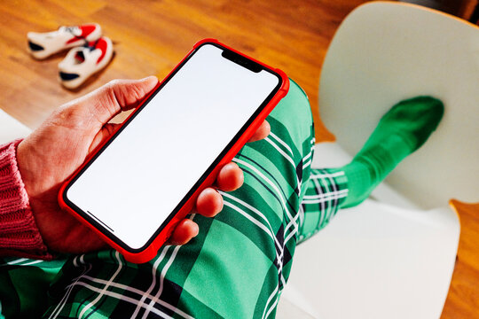 an empty phone screen seen from a seated position