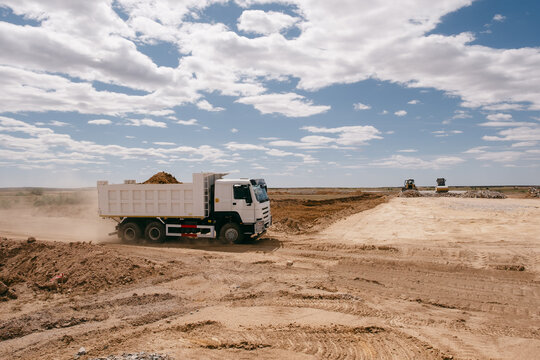 Dump Truck Driving on Construction Site
