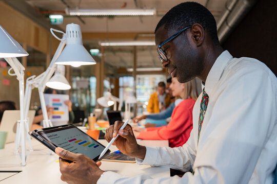 Business professional using tablet at modern office