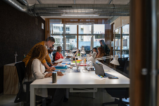 Modern office meeting with diverse team collaboration