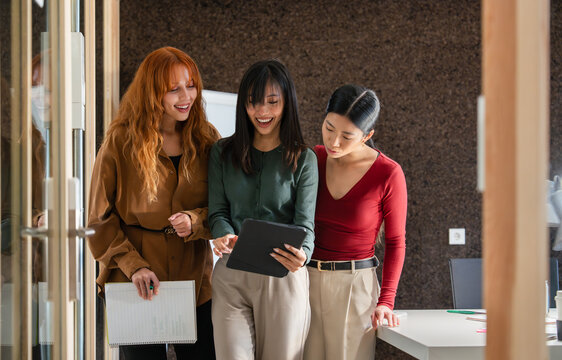 Colleagues collaborating in modern office setting