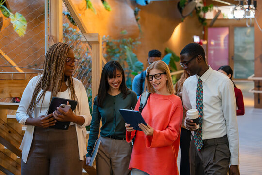 Diverse team discussing work in modern office setting