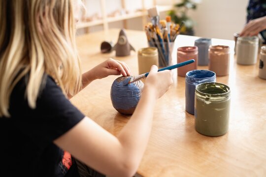 Child Painting Clay Pottery