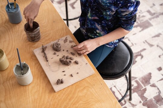 Student Working with Clay at Art Table