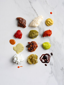 Different Sauces and Condiments on a Marble Surface for Cooking