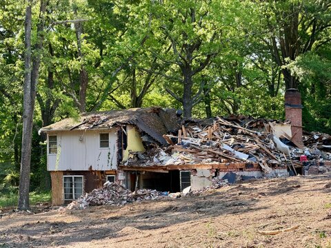 Old house structure knockdown tear down demolition for redevelopment