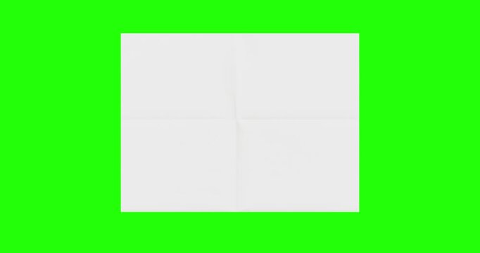 4k Resolution Video: Paper Mockup Concept. Blank White Paper Sheet Unfolds Against Green Screen Chroma Key Background With Alpha Matte