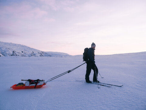 Portrait of  Male Backcountry Skier With Cargo Sled