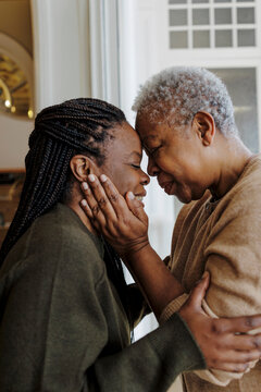 Mother and daughter showing warm bond and affection at home