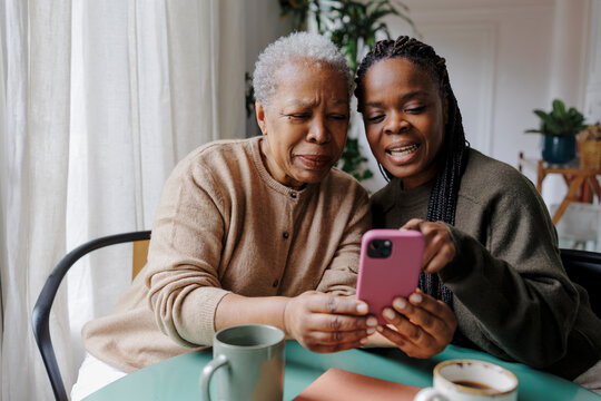 Family members bonding over smartphone content together