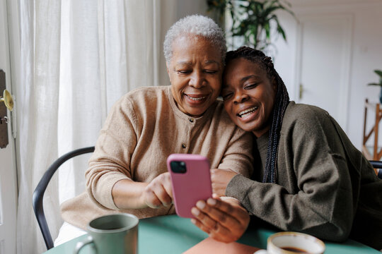 Family members bonding over smartphone content together