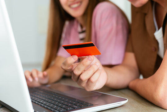Anonymous Couple Shopping Online with Credit Card at Home