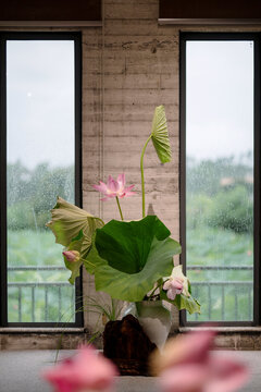 Dining table decorated with lotus flowers and leaves. closeup