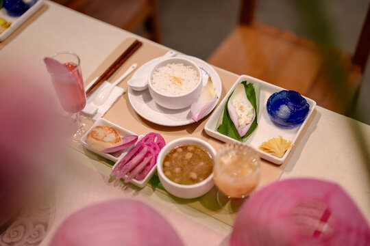 Dining table decorated with lotus flowers and leaves. closeup
