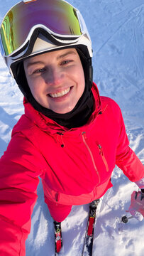 Happy Woman Skier Taking Selfie on Snow
