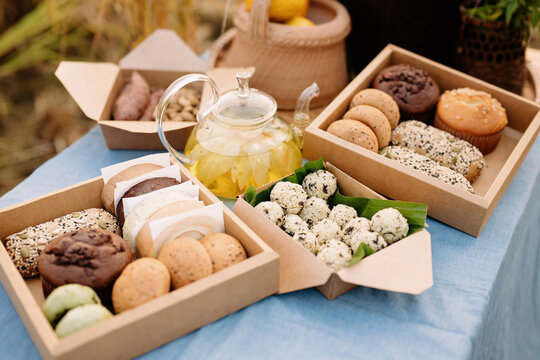 Closeup shots of handmade pastries and rice balls on a country table