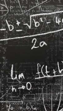 Vertical video: Camera moving down and zooming in revealing board quad formula and limit, education