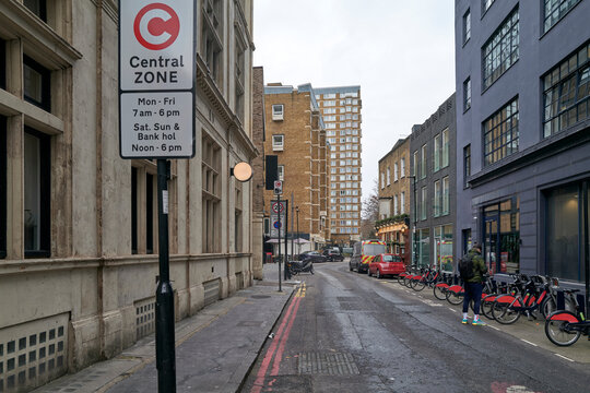 Street Scene in a Busy City Zone With Signs and Parked Bikes, LONDON