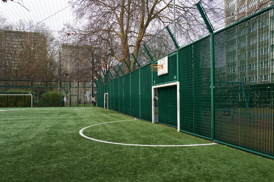 Soccer Field With Basketball Hoop in Community housing area
