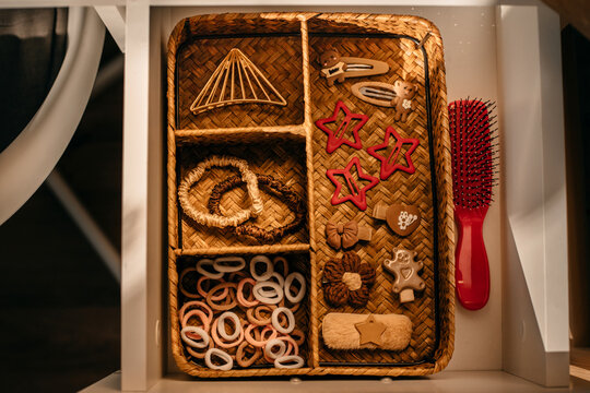 Well-organized storage of hair accessories in a girl's desk.