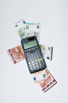 Person calculating money, savings and finances with math calculator