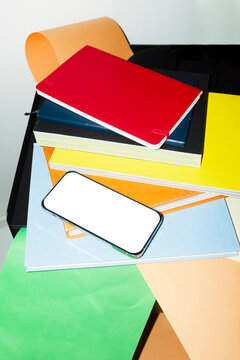 Phone mockup with empty screen for text or design on a office desk