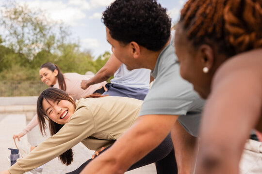 Outdoor workout with multiethnic friends in Madrid