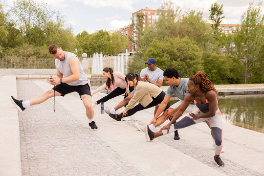 Outdoor multiethnic workout session in Madrid Rio