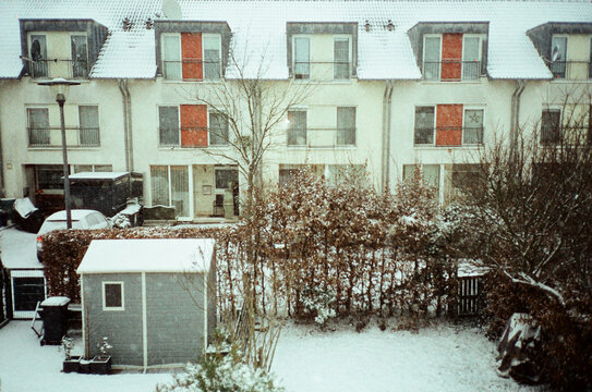 Snow-covered residential row houses in winter