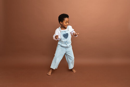 Happy young girl dancing and having fun