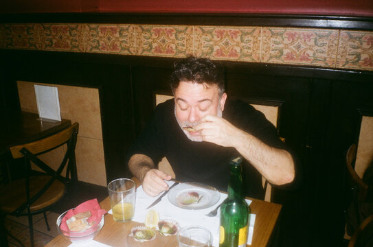 Film Camera Photo Of Man Enjoying Spanish Tapas