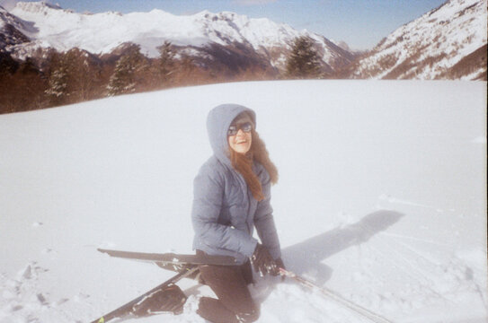 Film Camera Photo Of Laughing Woman Fall With Skis