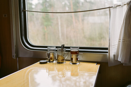 Tea is on the table on the train.