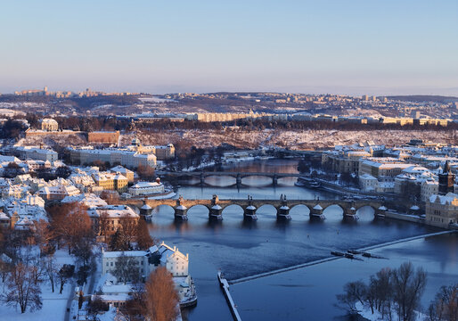 Prague's Charles Bridge at sunrise after snowfall