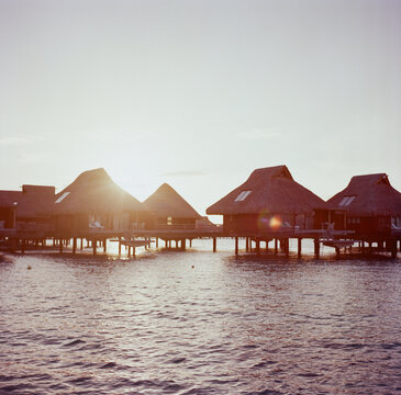 Over-water villas in sunset