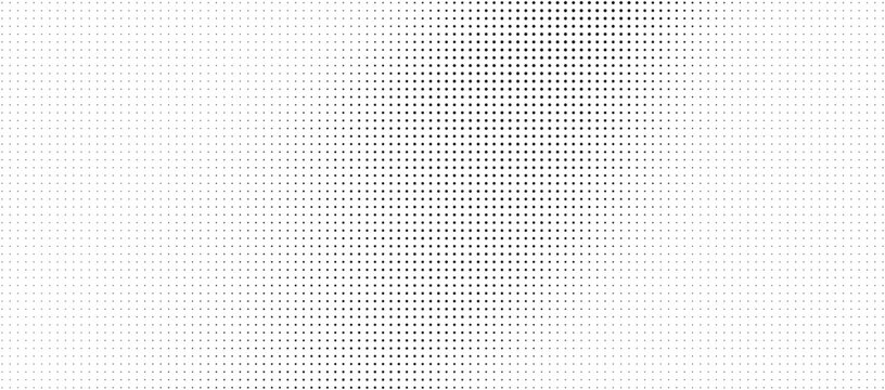 Halftone pattern with varying dot density on white background for design
