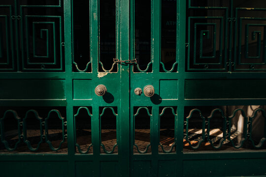 Vintage green metal doors with decorative pattern