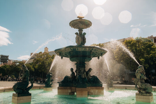 Historic fountain with sculptures in Lisbon square