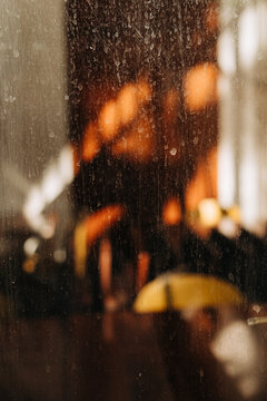 Dirty window with warm sunlight behind the glass