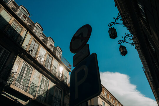 Upward street view with balconies and blue sky