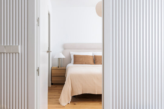 Bedroom Framed by Ribbed Panels