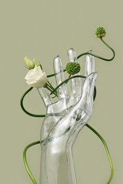 Glass hand with rose and allium stems