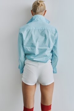Back View Anonymous Woman In Blue Shirt 