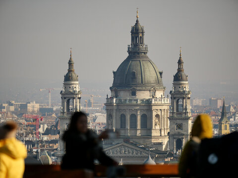 Cathedral in central Budapest seen with tourists in foreground.