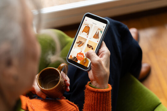 Senior woman shopping clothes online home